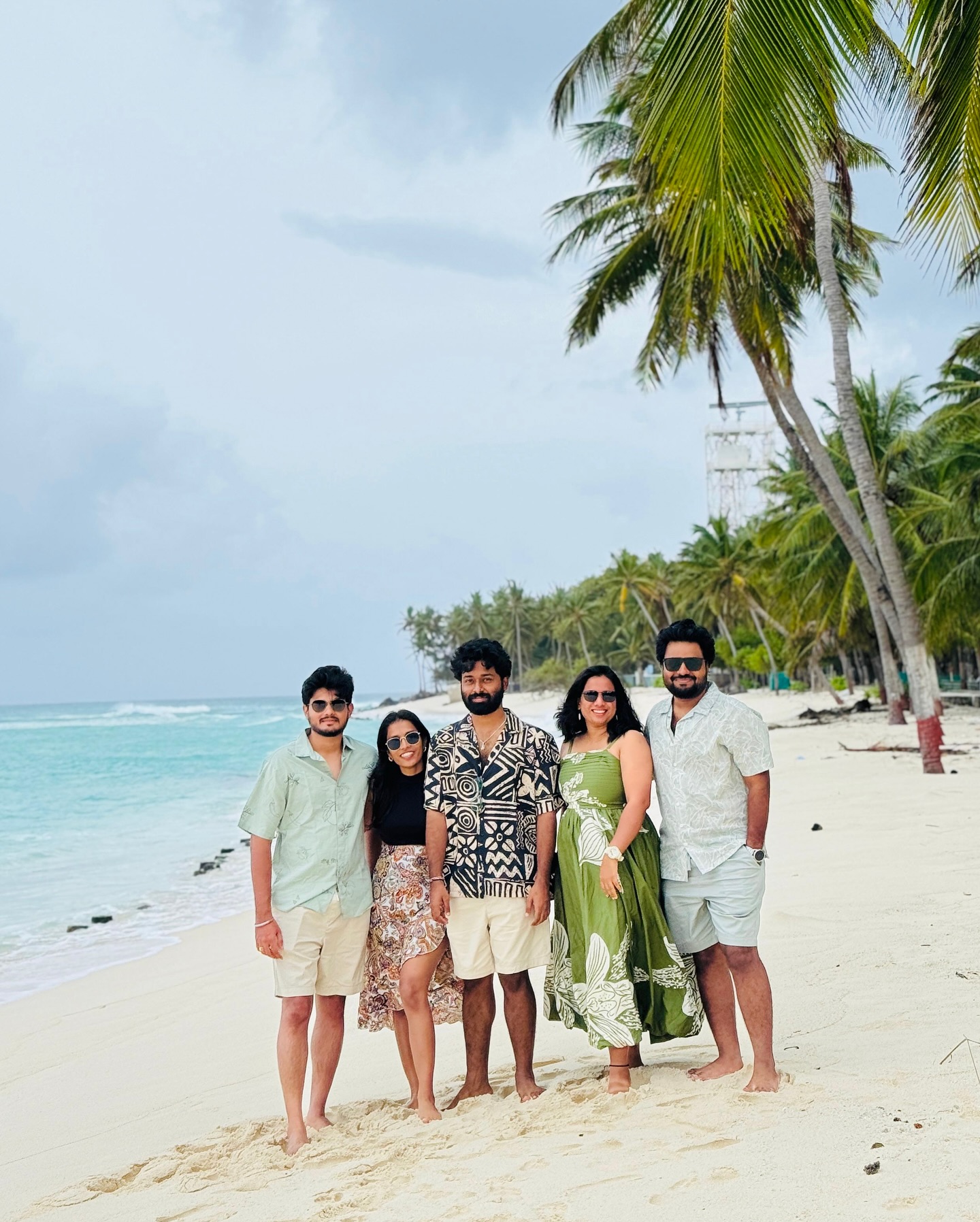 Group of friends on a white-sand Lakshadweep beach